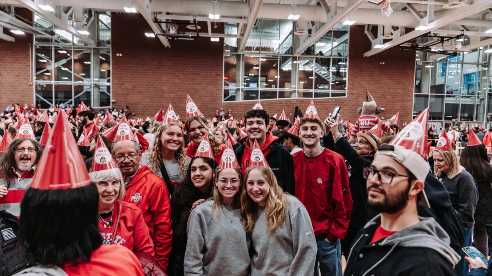 Crowd of people wearing conical hats