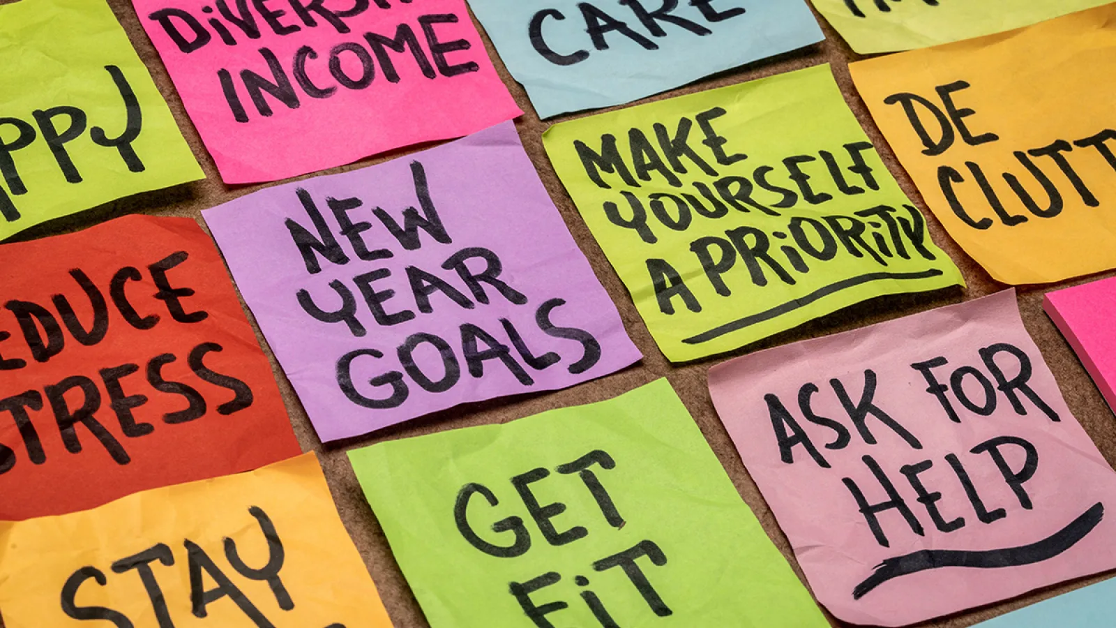 Rows of colorful sticky notes with different things written on them, including "Get Fit" and "New Year Goals"