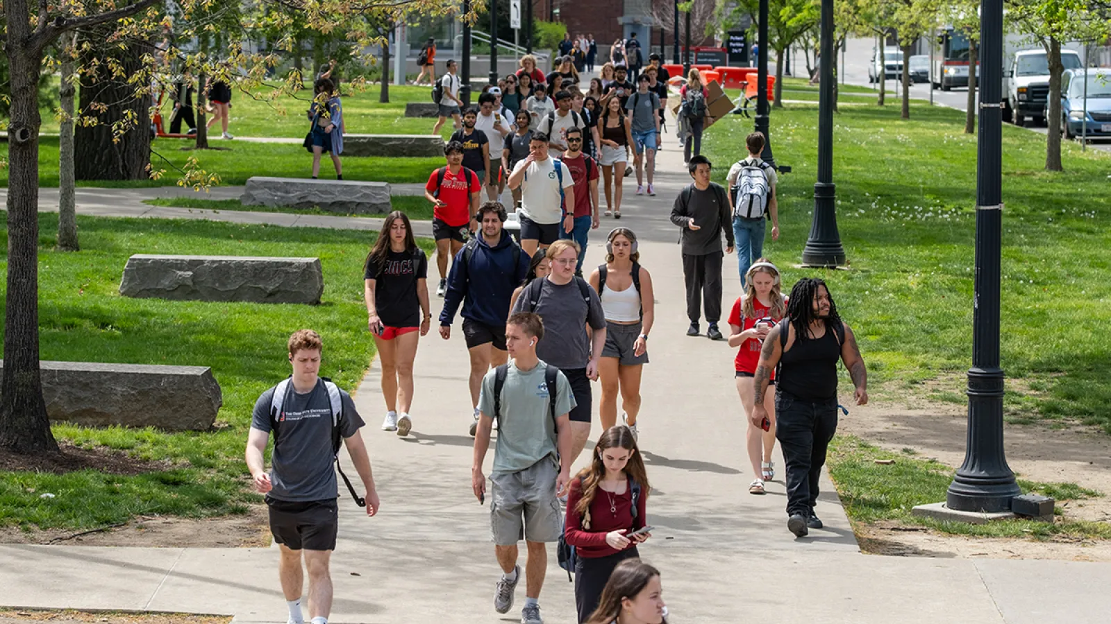 Students walking on campus on a sunny day