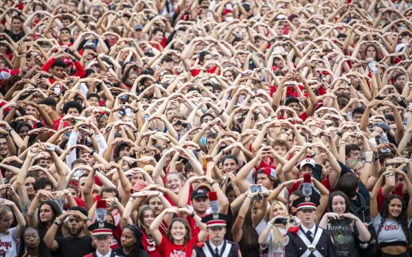 Large group of students with hands in the "O" shape