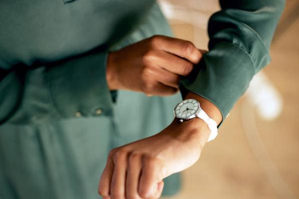 A person checking their wrist watch