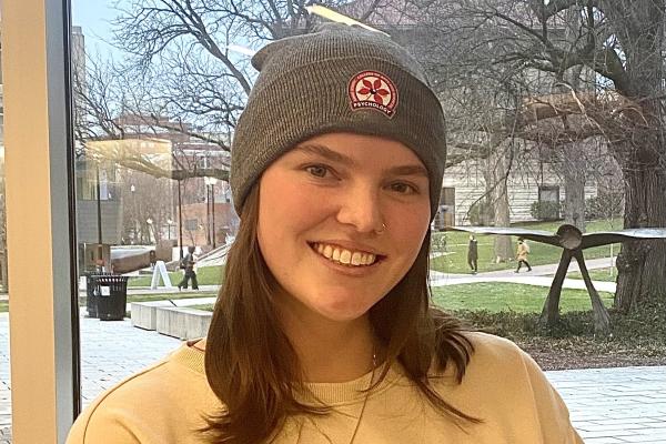 Student wearing an OSU-themed Beanie