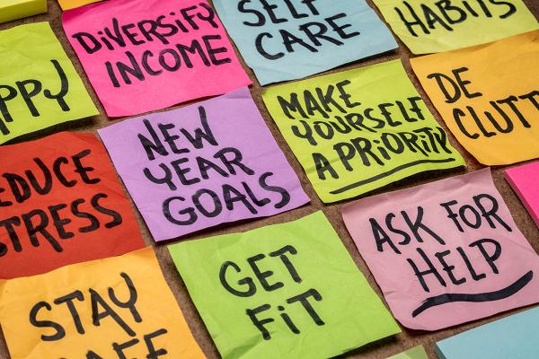 Rows of colorful sticky notes with different things written on them, including "Get Fit" and "New Year Goals"