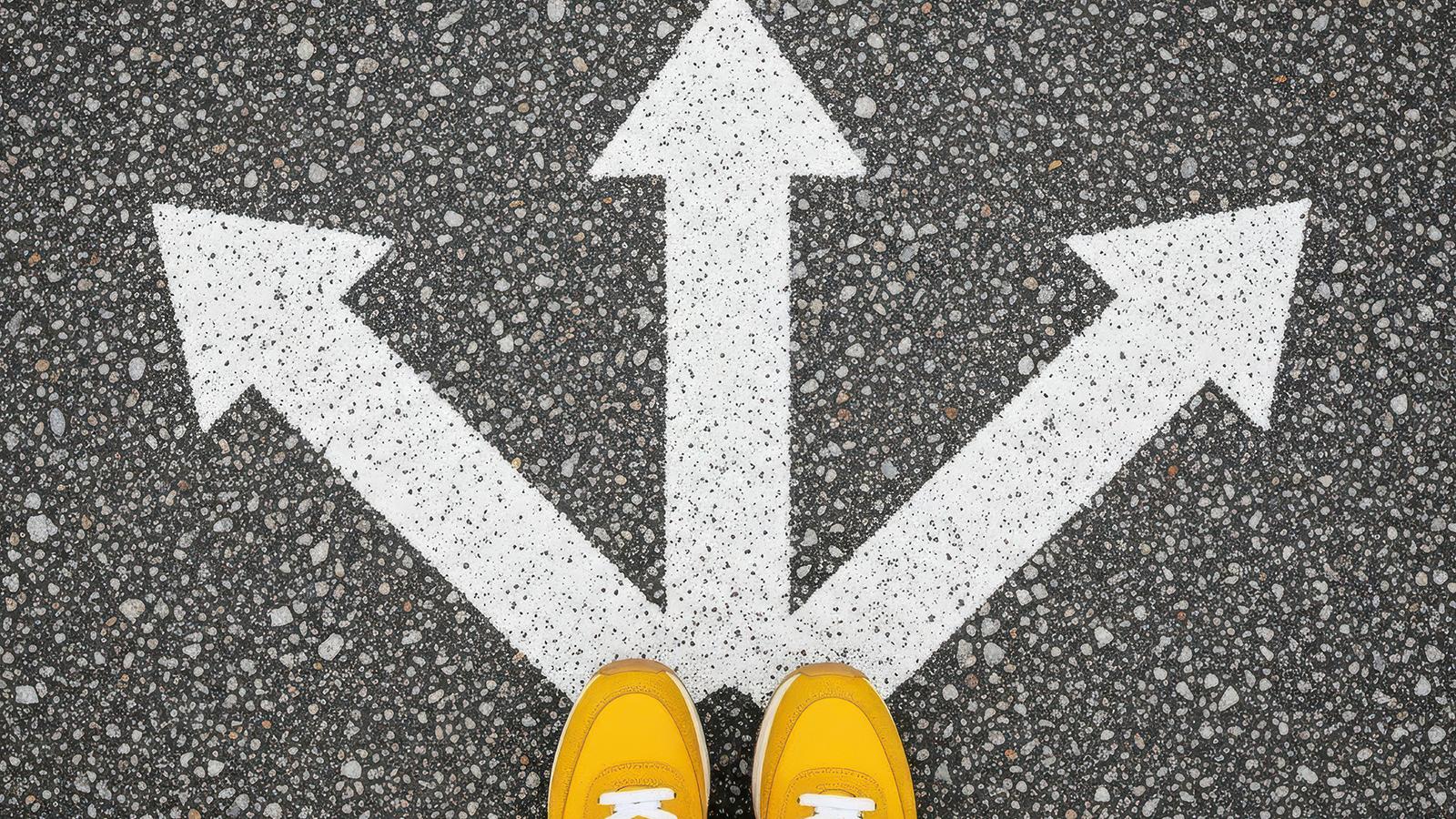 3 arrows pointing northwest, north and northeast with yellow shoes at merge point